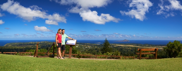 A couple stands at the top of the Mt Pitt lookout